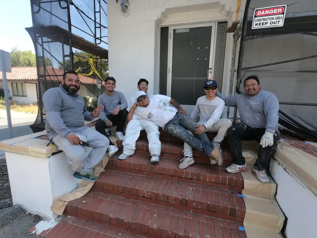 Integrity Paint & GC team standing together in front of a project in the East Bay, California