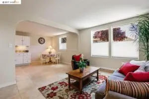 Bright living room with painted walls and white trim in an East Bay home by Integrity Paint and General Contracting