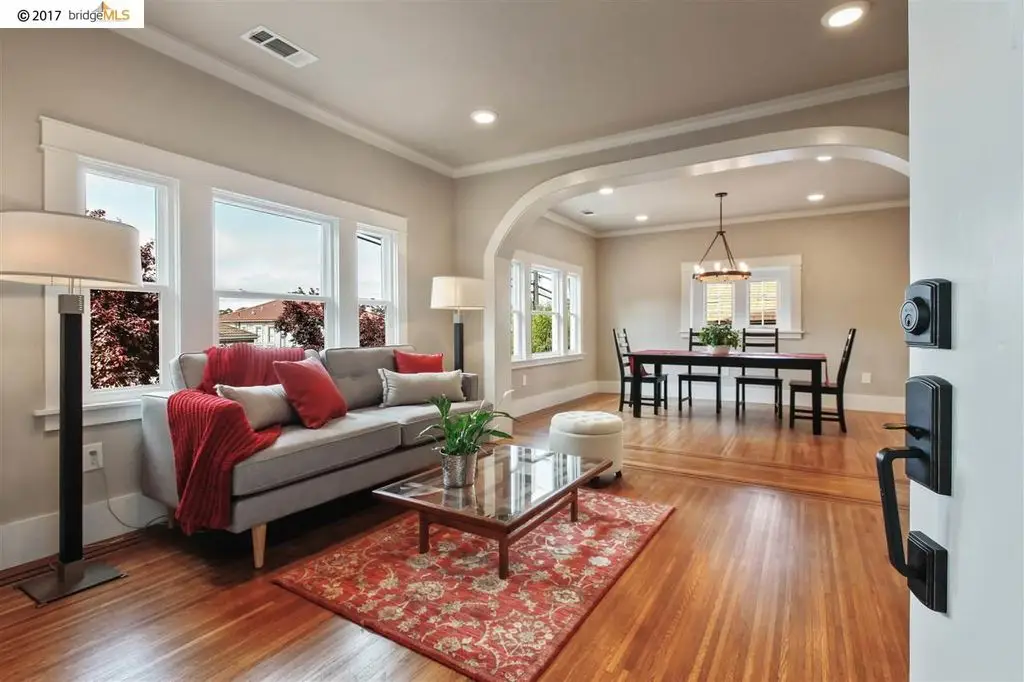 interior painting of a living room and kitchen
